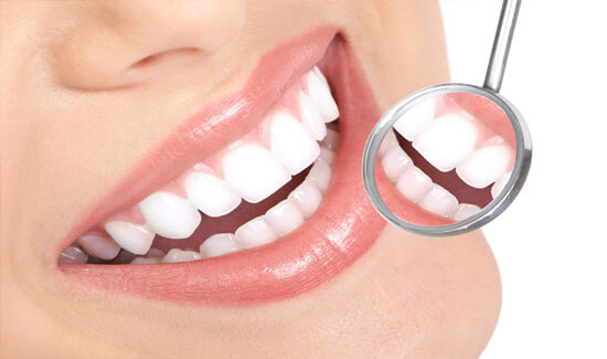 Picture of a smiling woman, showing her happiness with the all-on-two dental treatment she had in Costa Rica.