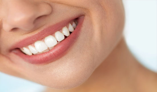 Picture of a smiling woman, showing her happiness with the Huggins-Grube Protocol she had in Costa Rica.