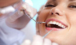 Picture of a smiling woman having a Homeopathy treatment by Premier Holistic Dental in London.